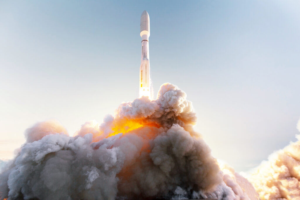 Space rocket takes off into space with clouds of smoke and fire